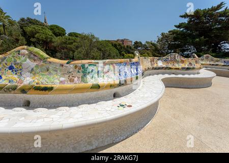 Barcelona, Spain - June 24, 2023: Famous Gaudi`s masterpiece, serpent bench made of mosaic tiles in Park Guell in Barcelona Stock Photo